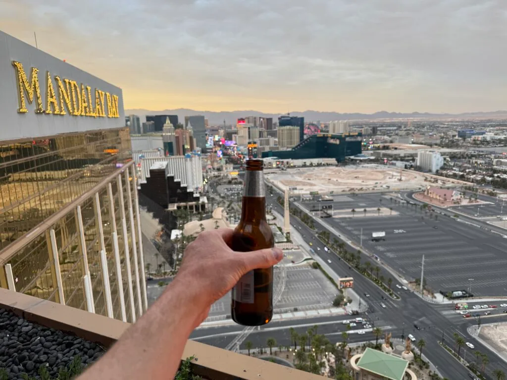 The view from the top floor of Mandalay Bay. I'm holding a bottle of beer out into the picture. 