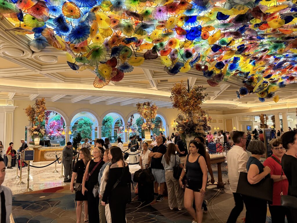 Bellagio's hotel lobby with glass, illuminated flowers on the ceiling. 