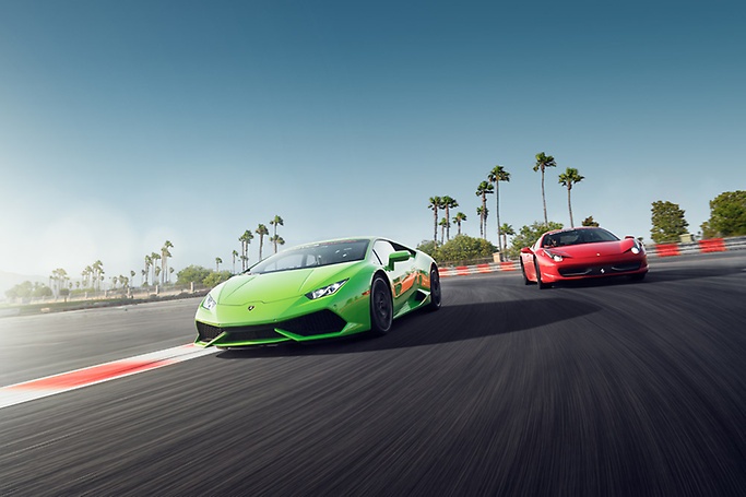 2 Lamborghinis race on a track