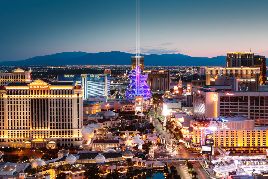 A rendering of Hard Rock's guitar shaped hotel sits illuminated along the Strip in Las Vegas