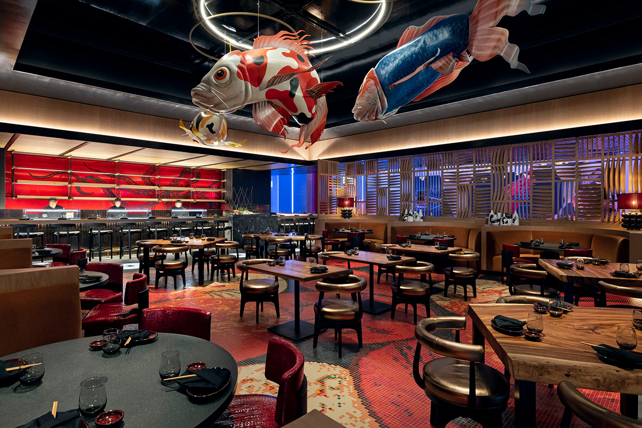 Dining area at Kusi Nori. Hanging from the celing are large artistic depictions of colorful coy fish.