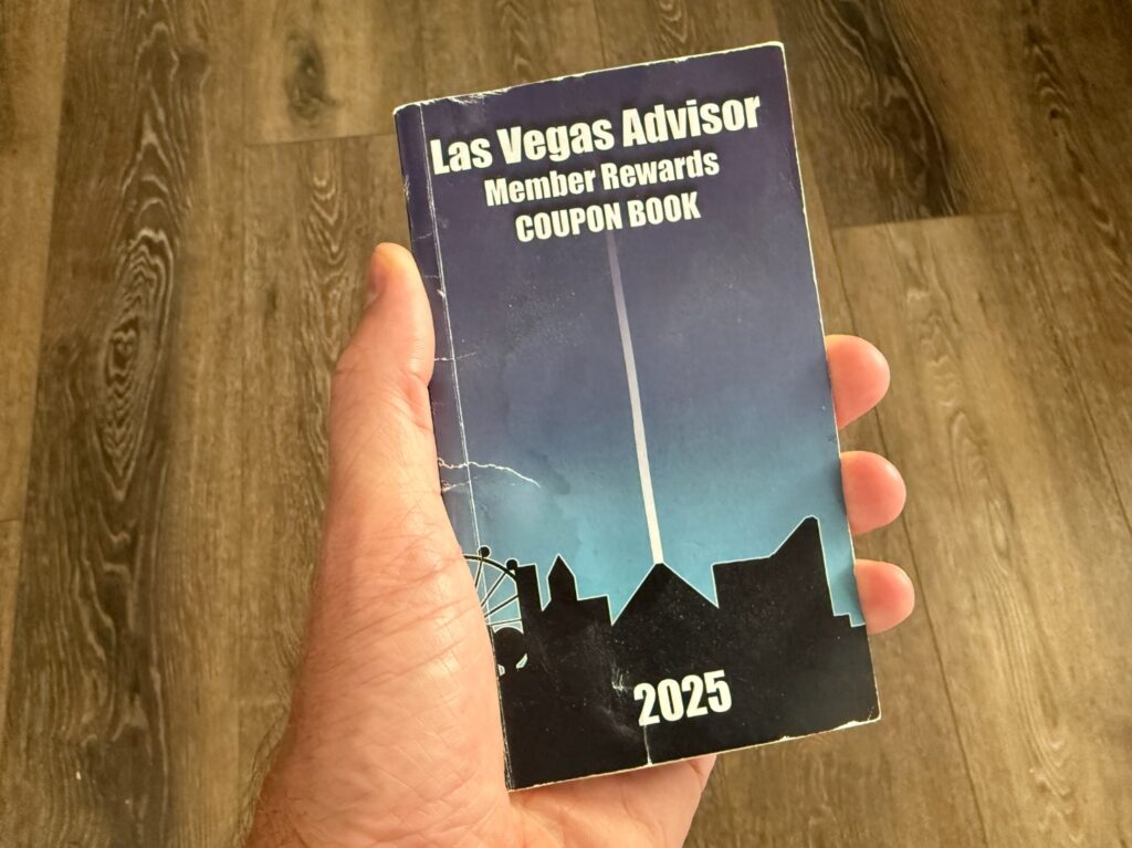 The Las Vegas Vegas Advisor coupon book in my hand. 