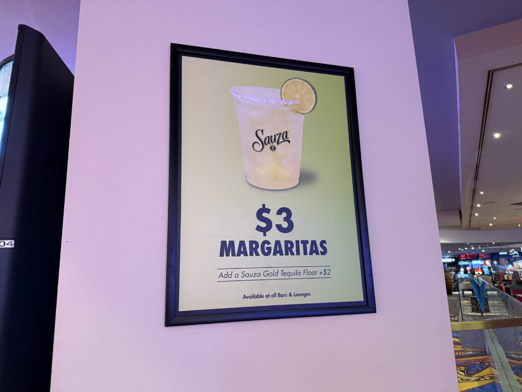 A sign advertising $3 margaritas at Luxor. 