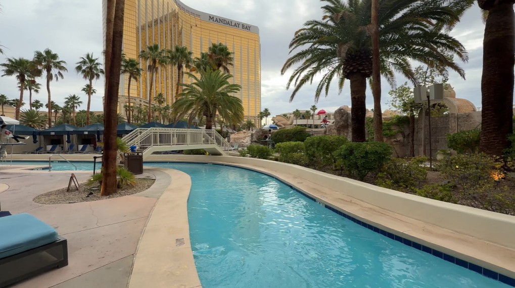 Manadalay Bay's lazy river in the foreground with the gold hotel tower behind it.