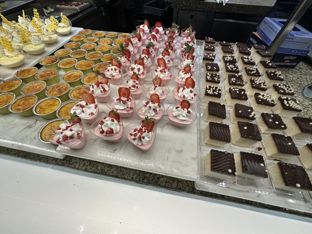 Creme Brulee, and other assorted desserts on display.