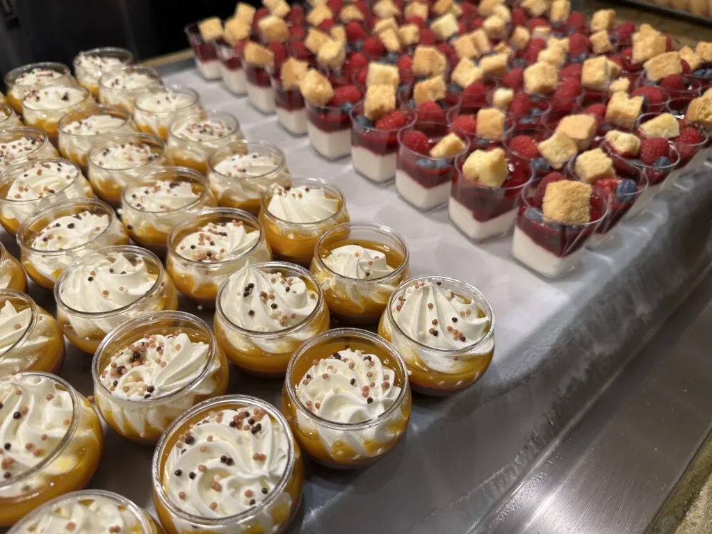 2 different dessert varieties lined up on trays. 