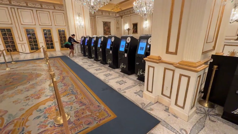 A row of automated check in kiosks at Paris. 