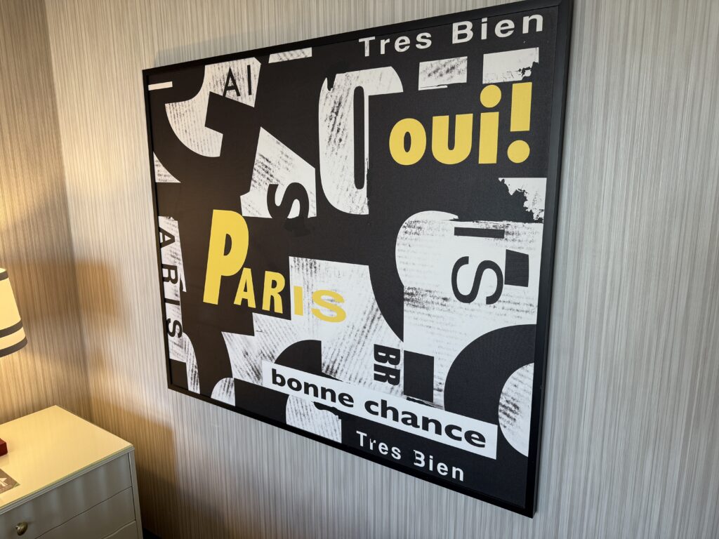A wall art piece with french words on it. 