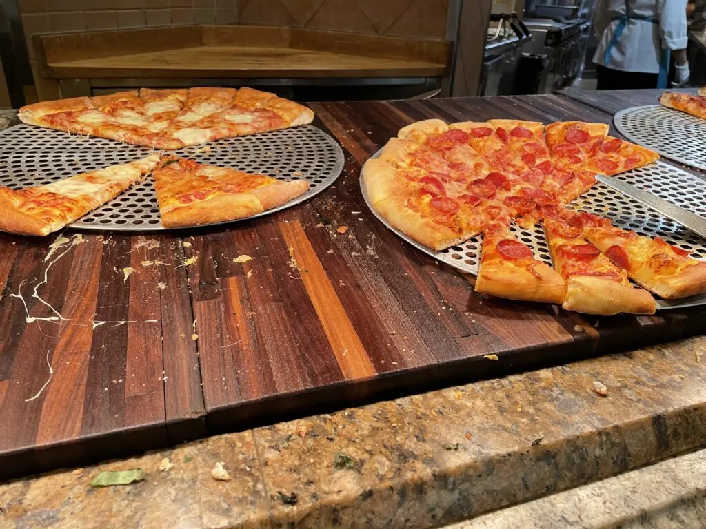 Two sliced pizzas