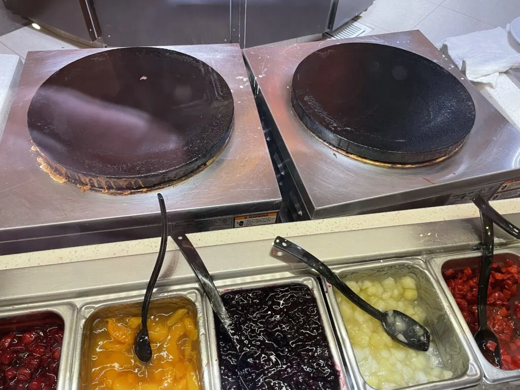 Live action crepe station griddle and toppings