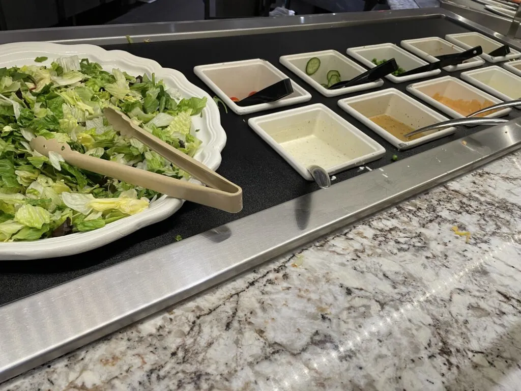 salad bar with lettuce nad toppings