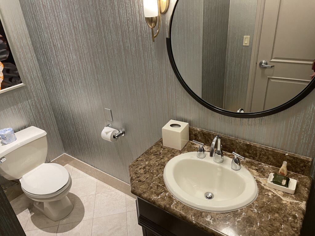 Sink and toilet in the first of two bathrooms