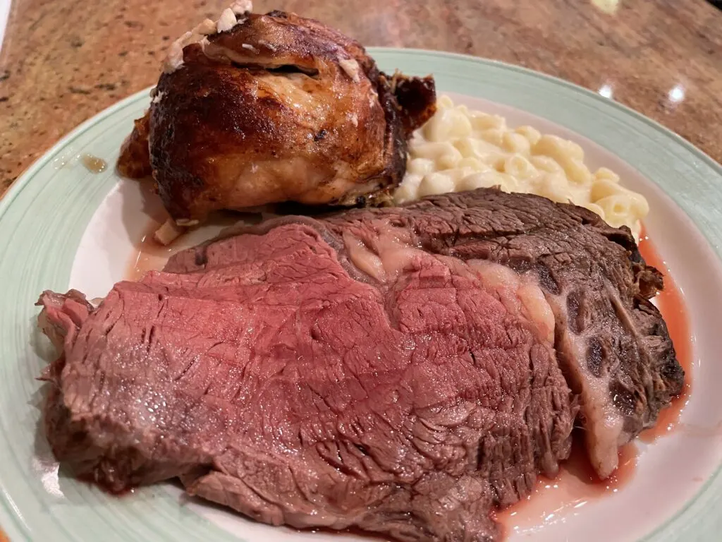 Plate with prime rib, chicken, and mac and cheese