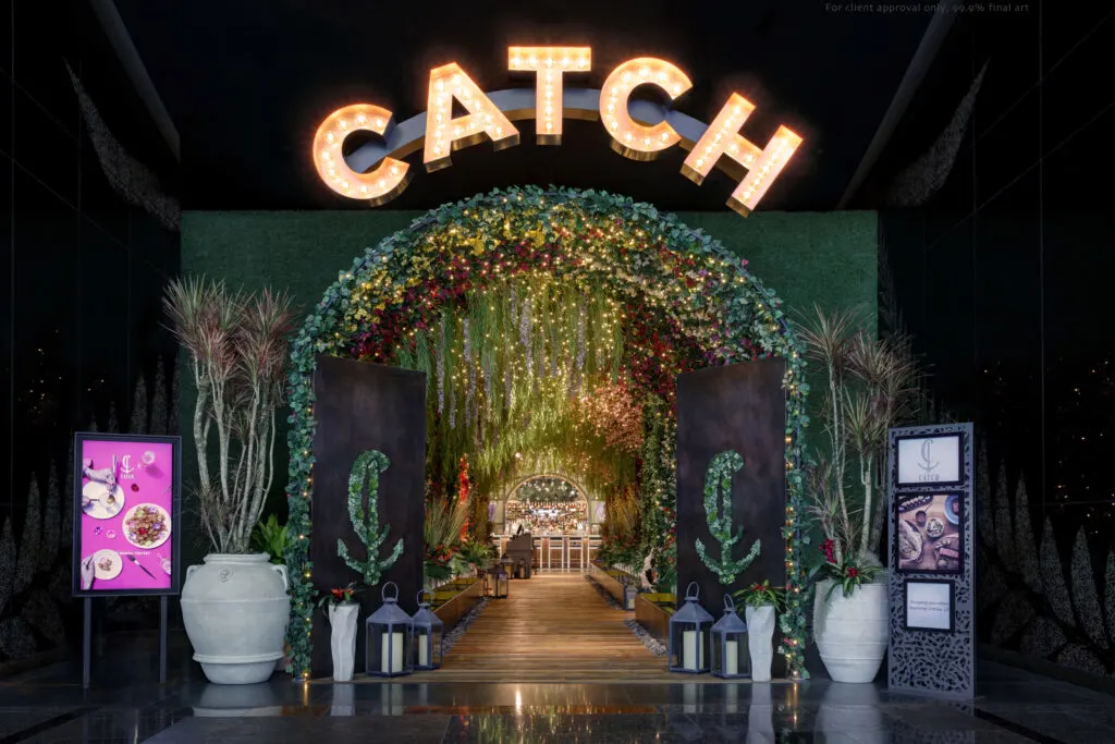 Entrance to Catch with the word "CATCH" illuminated above the hallway