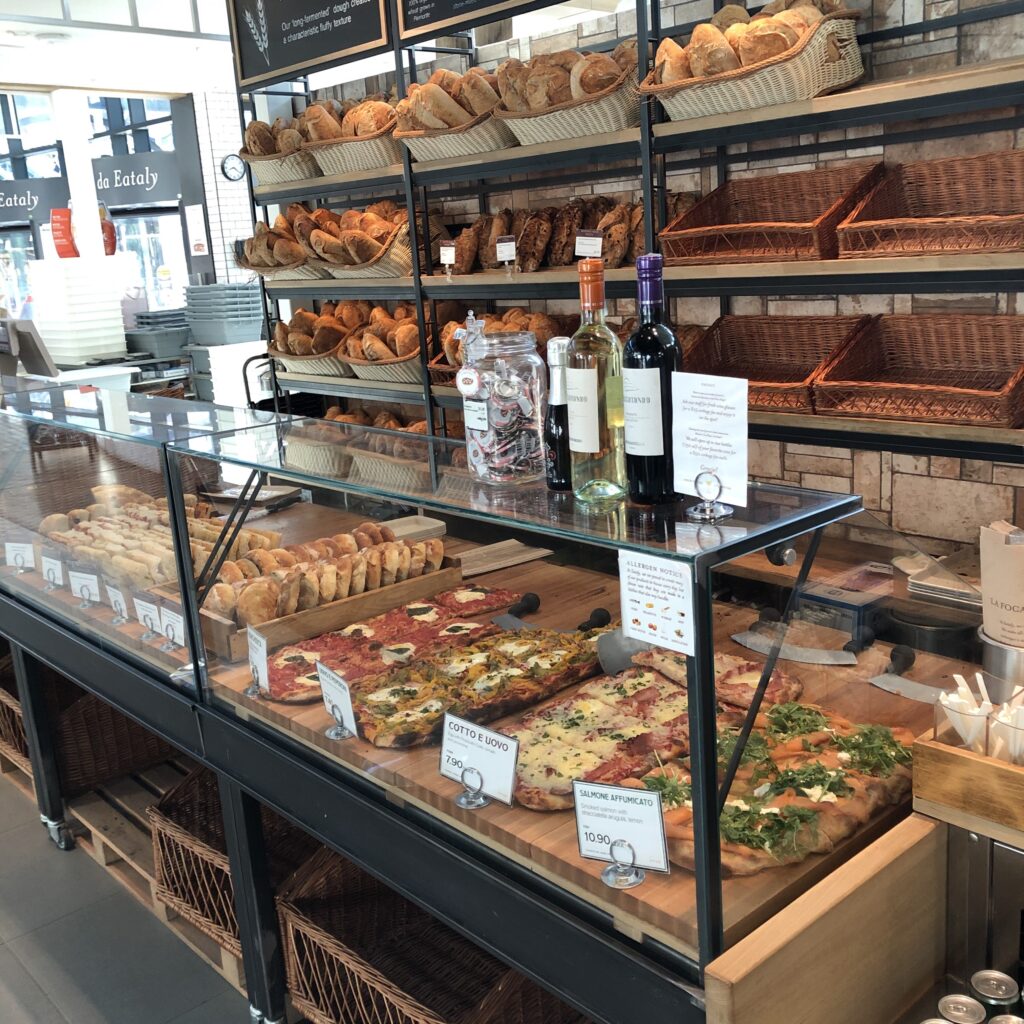 Food options like pizza on display at Eataly