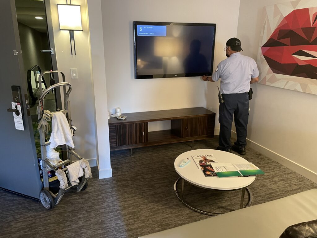 A technician works on our TV at LINQ