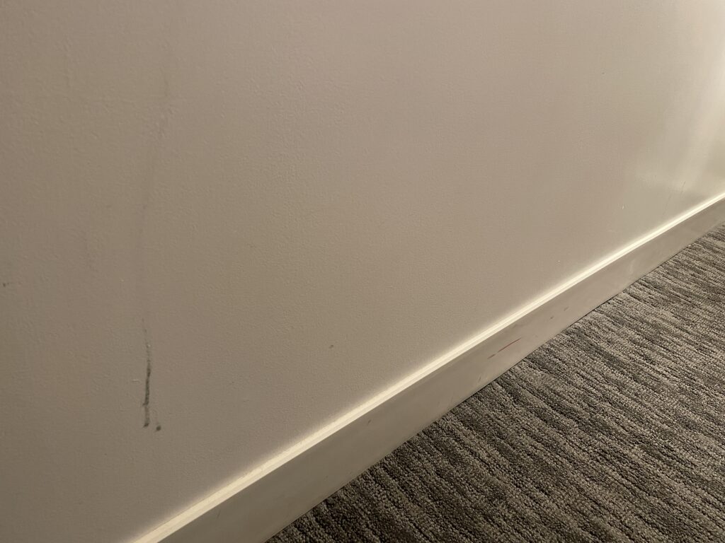 Black scuffs on wall