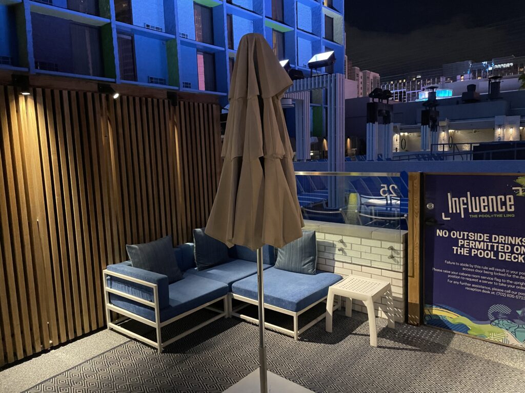 Linq's poolside cabana at night with Linq's hotel tower in the background