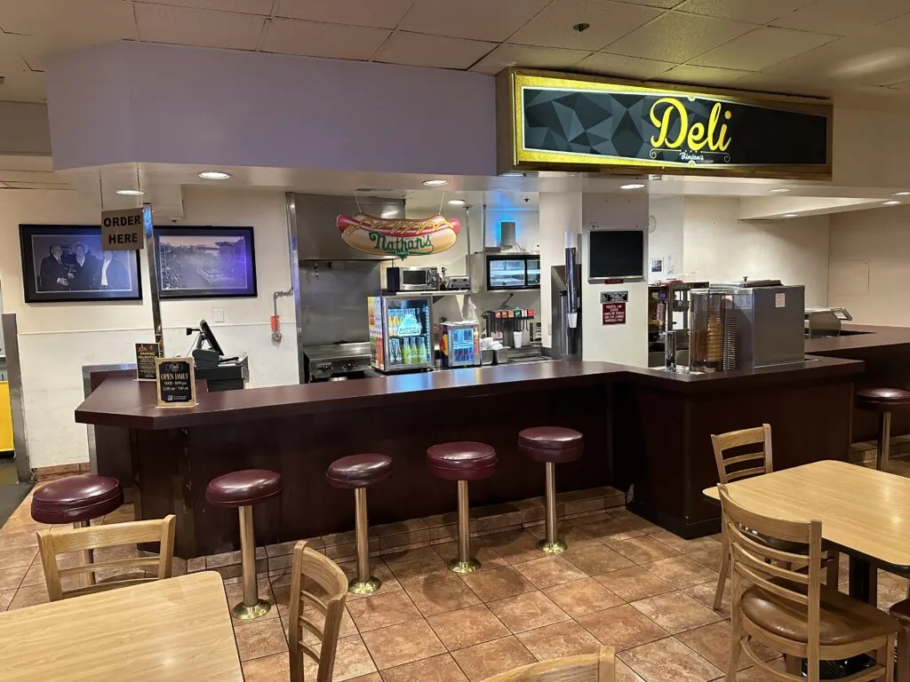 Empty seating area and counter at Binion's Deli. 