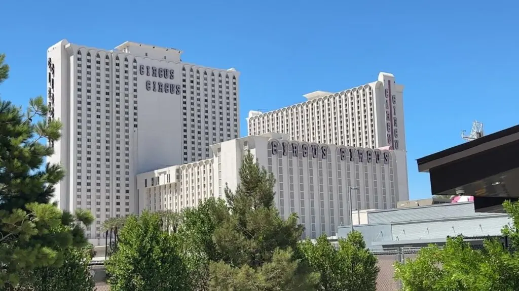 Circus Circus' hotel towers with trees in the foreground