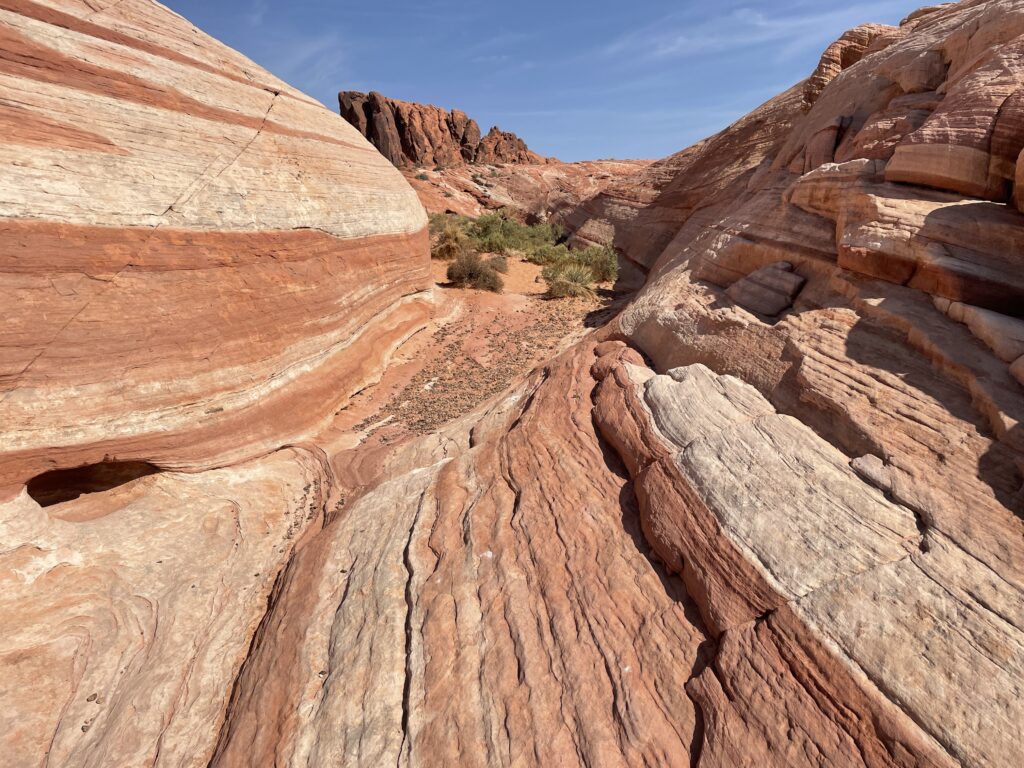 Rock formation with different color bands extending into the distance