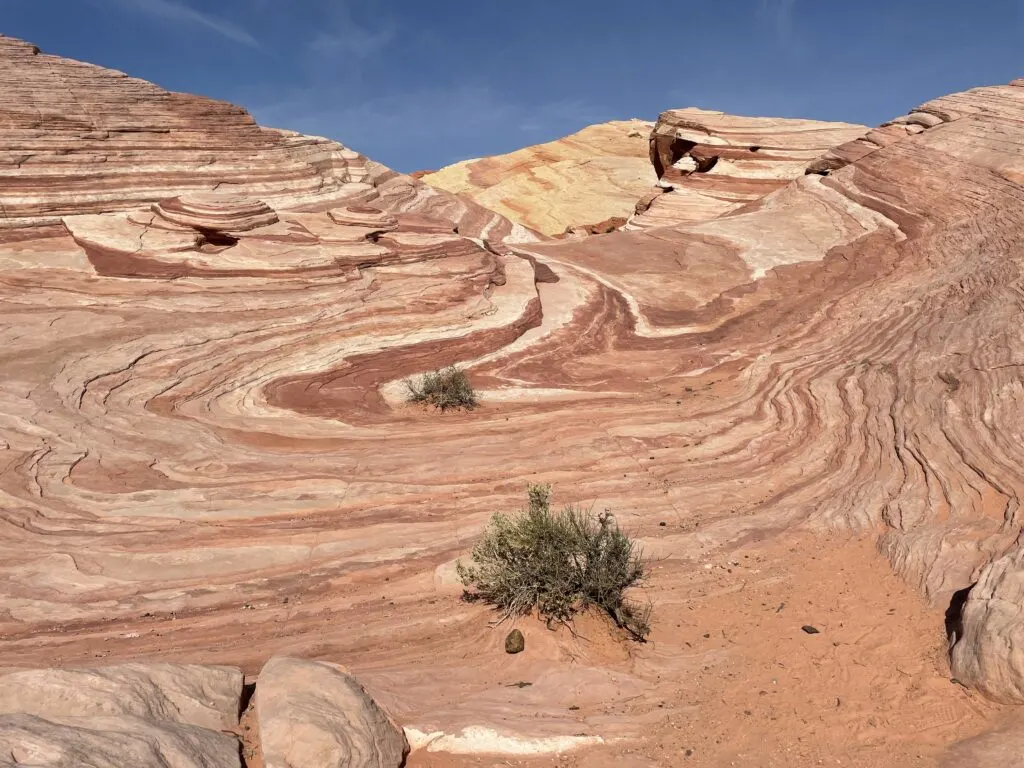 Several rock hills made up of various colored swirls of rock