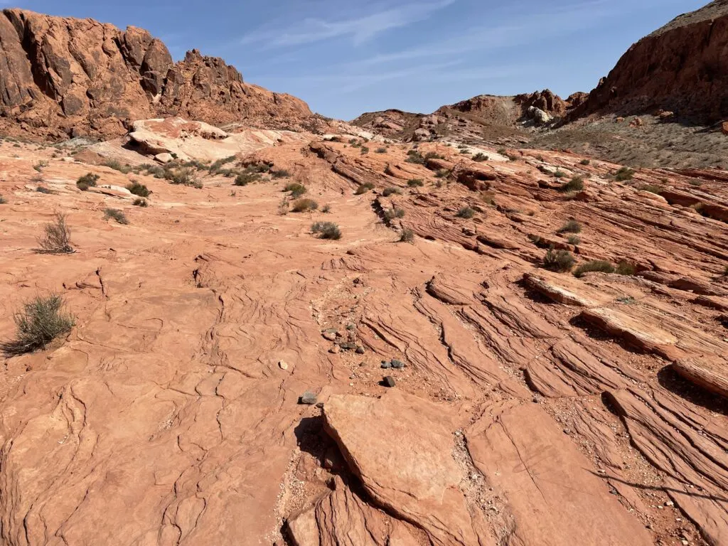 The trail levels off onto a large, flat, piece of rock