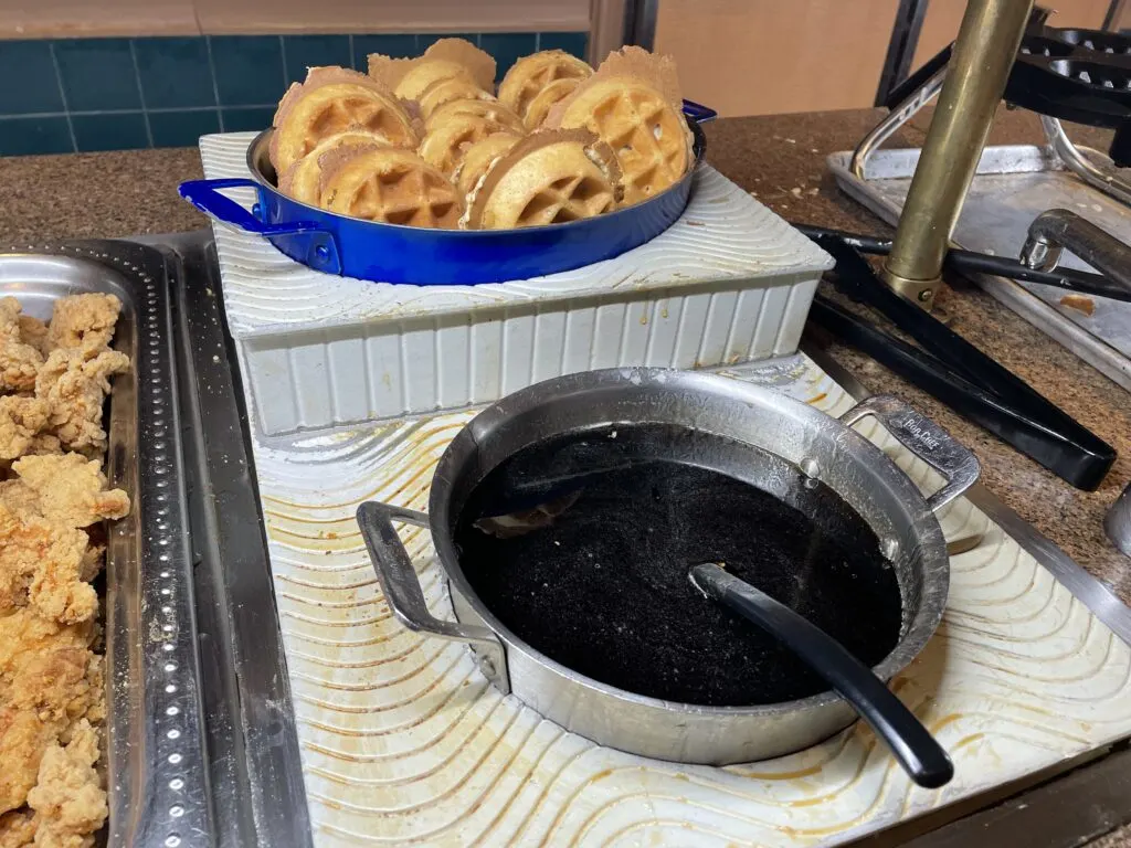 Mini waffles with syrup at the buffet