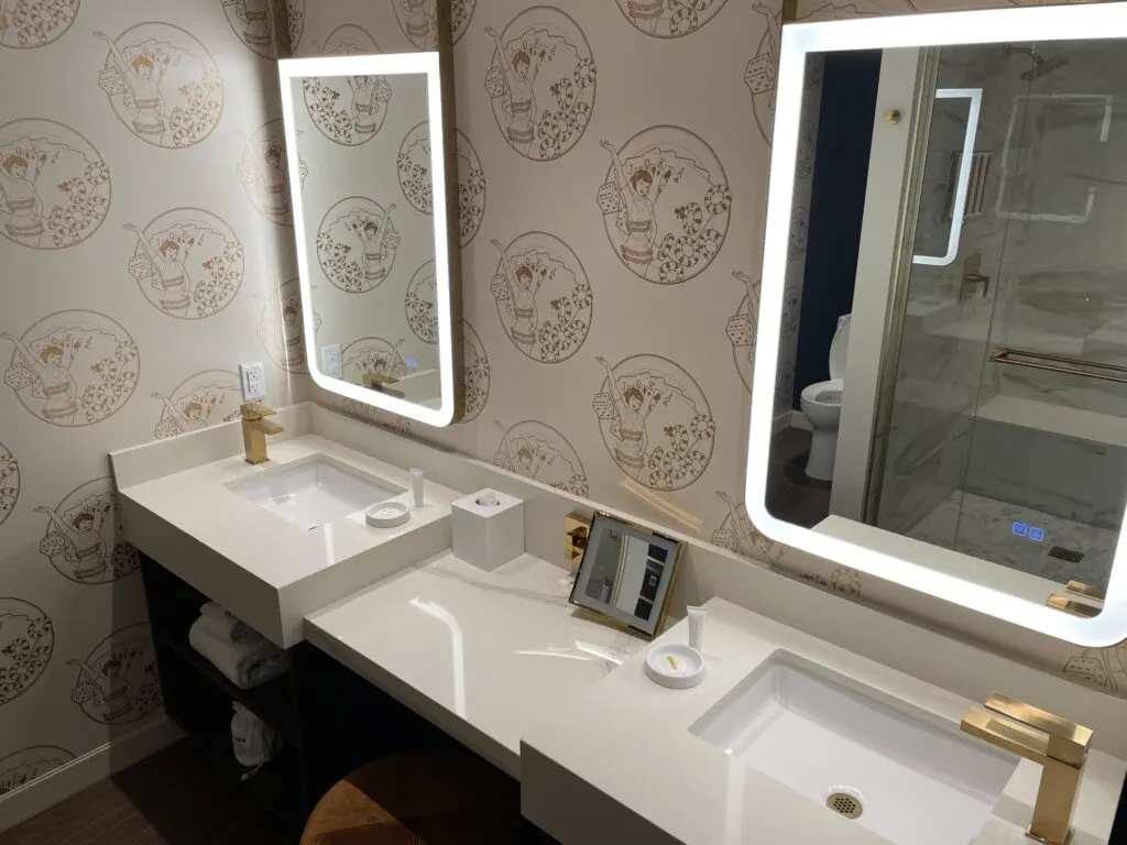 Dual sink vanity with two small square mirrors with built in illumination