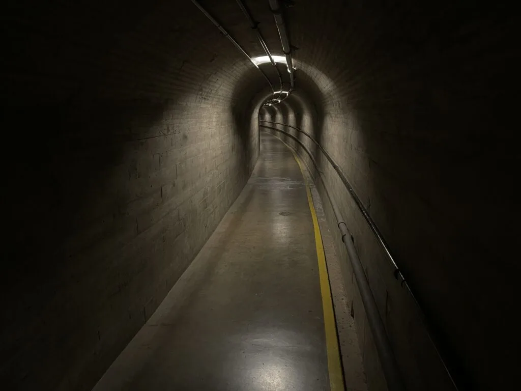 Dark, concrete tunnel through the Hoover Dam