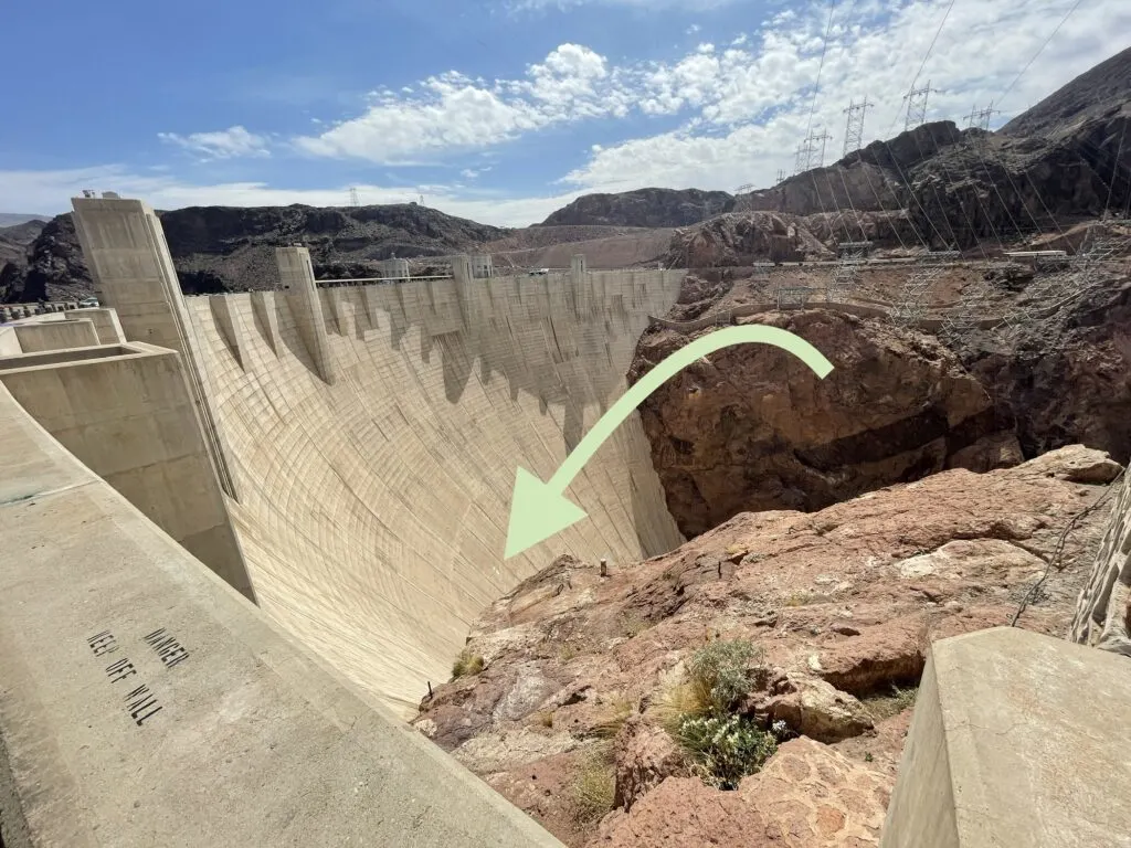Hoover Dam face with a green arrow pointing to the ventilation shaft I was peeking out of