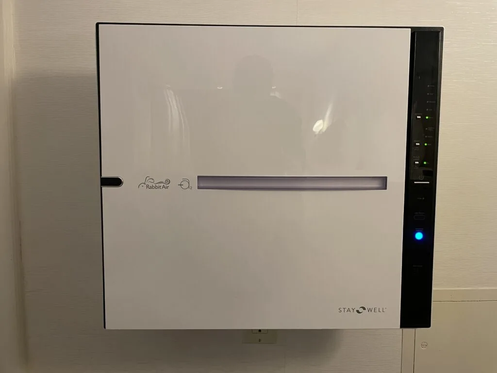 Air filtration unit mounted on the wall in the suite's bedroom