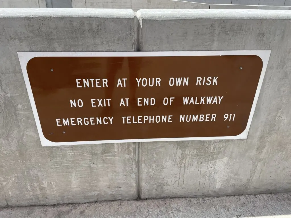 Sign that Says "Enter at your own risk"