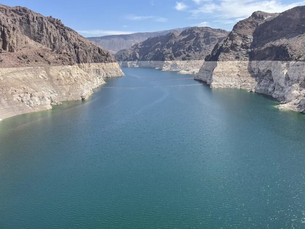 Lake Mead behind the Hoover Dam with a white bathtub ring visible on the canyon walls