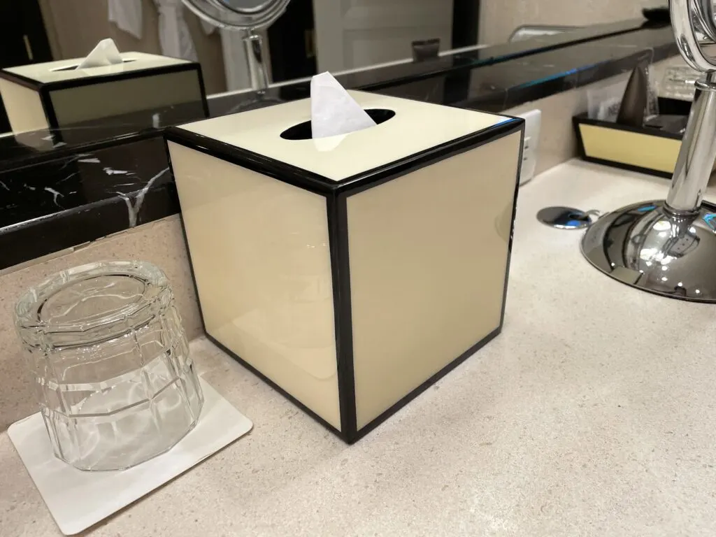 Creme tissue box with dark brown trim that matched the decor of the room