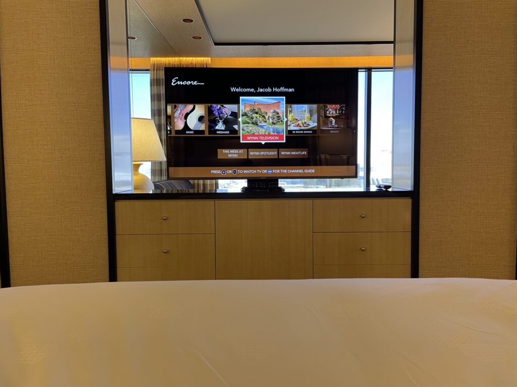 View of the TV taken from the bed