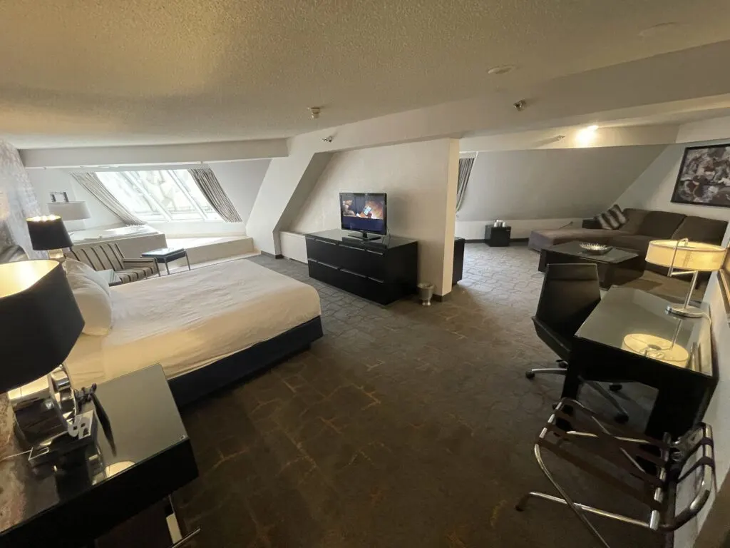 The hotel suite with the bedroom on the left and the living area to the right