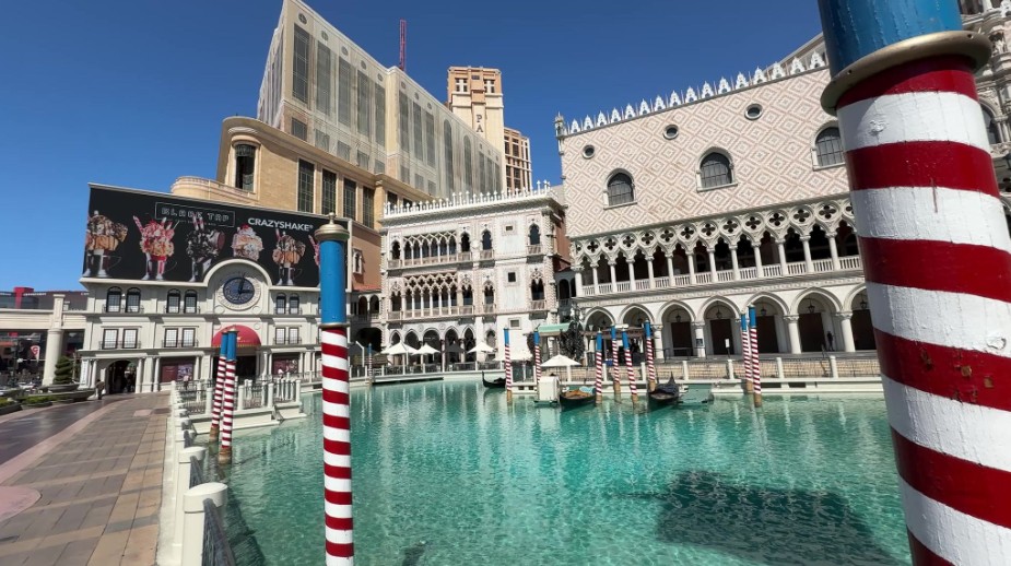 Gondolas navigate the waterway in front of The Venetian.