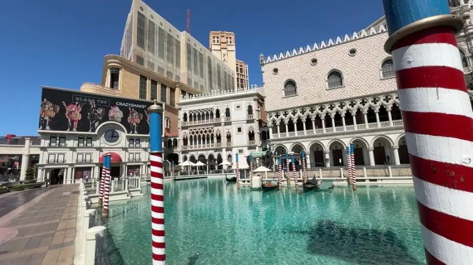 Gondolas navigate the waterway in front of The Venetian. 