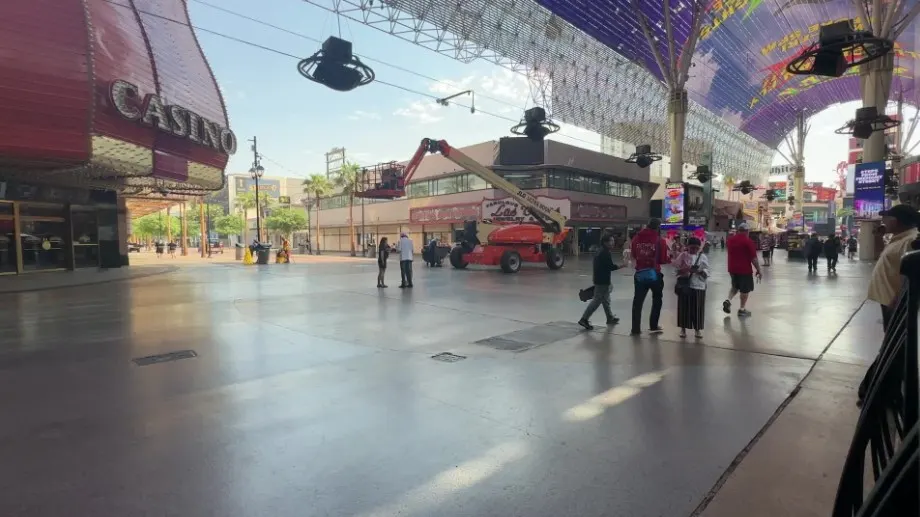 View of people walking past on Fremont Street from Patio Bar. 