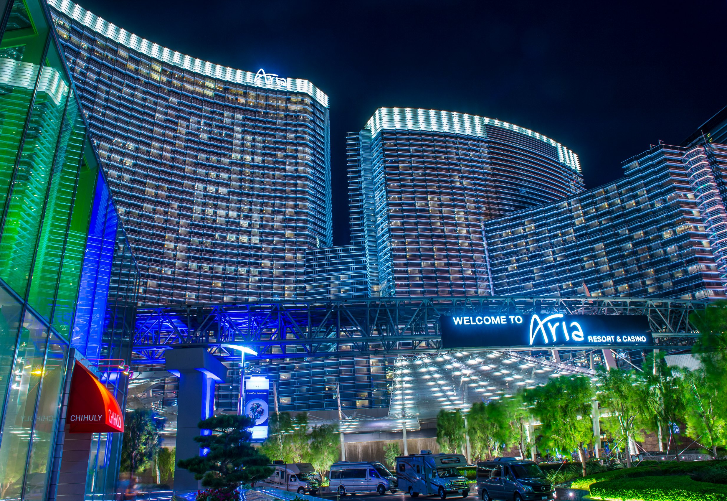 Aria's exterior at night, with many guestrooms illuminated