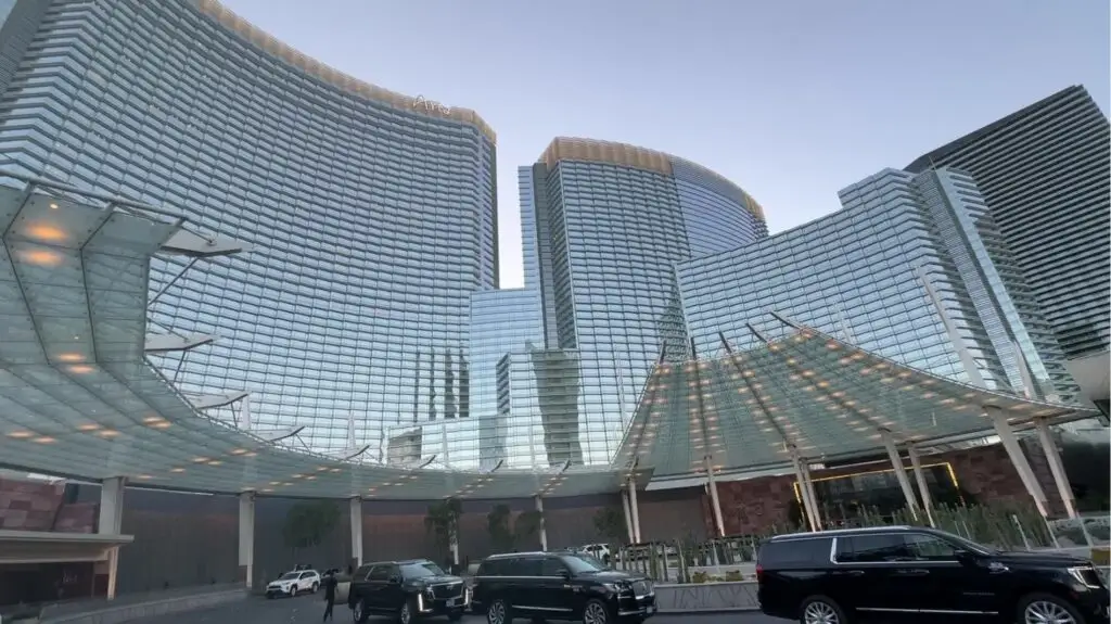 Exterior of Aria's glass hotel tower and porte cochere.