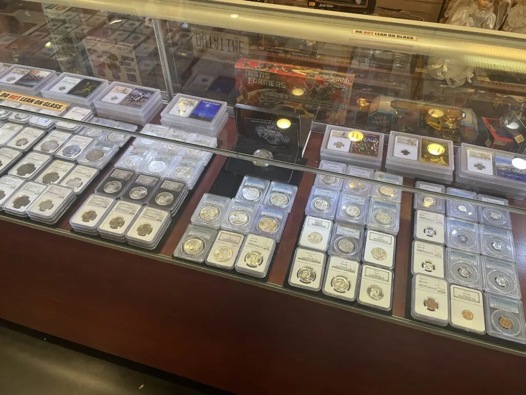 Coins on display under glass