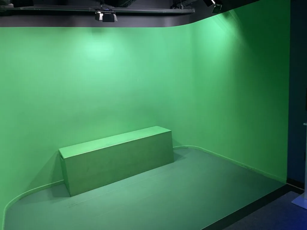 Green Screen with a green bench for a souvenir photo opportunity