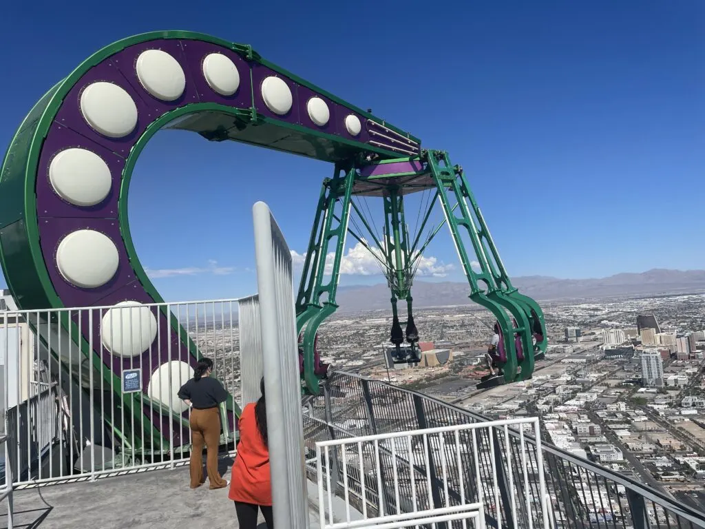 Insanity's arm extending riders out over the edge of the tower