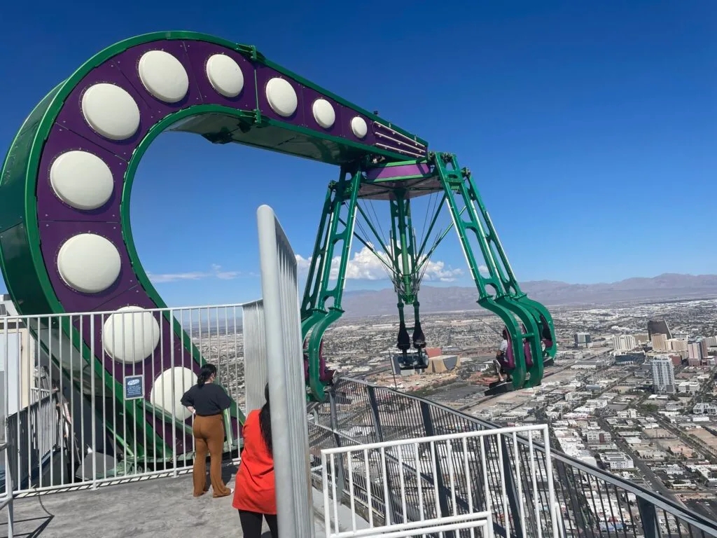 Insanity's arm extending riders out over the edge of the tower