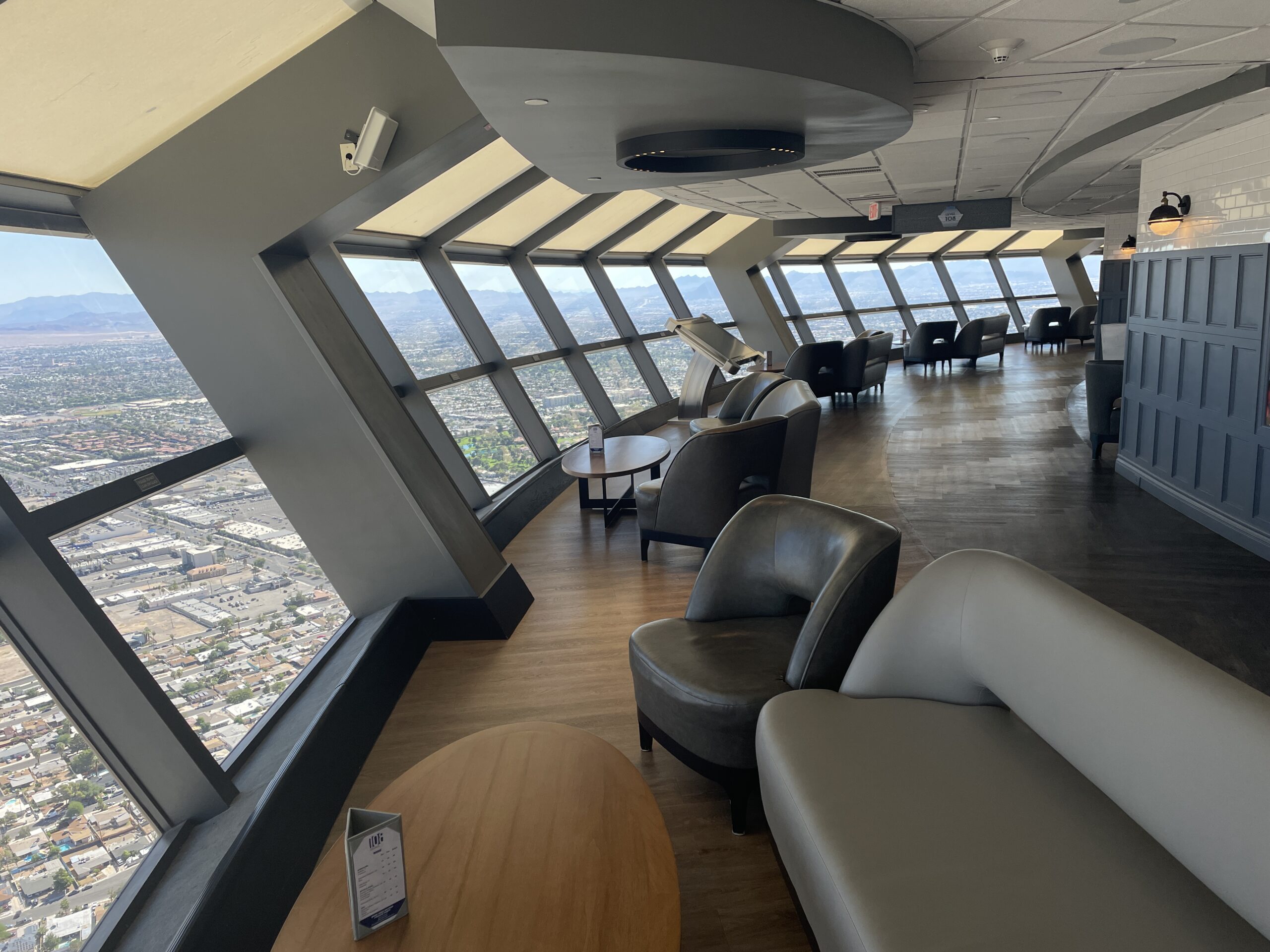 Angled windows with a view of Las Vegas below in STRATs indoor observation deck