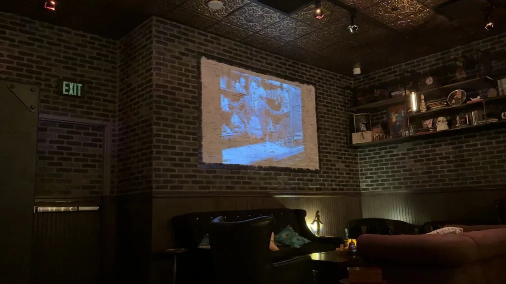 A black and white film, projected on the wall. 