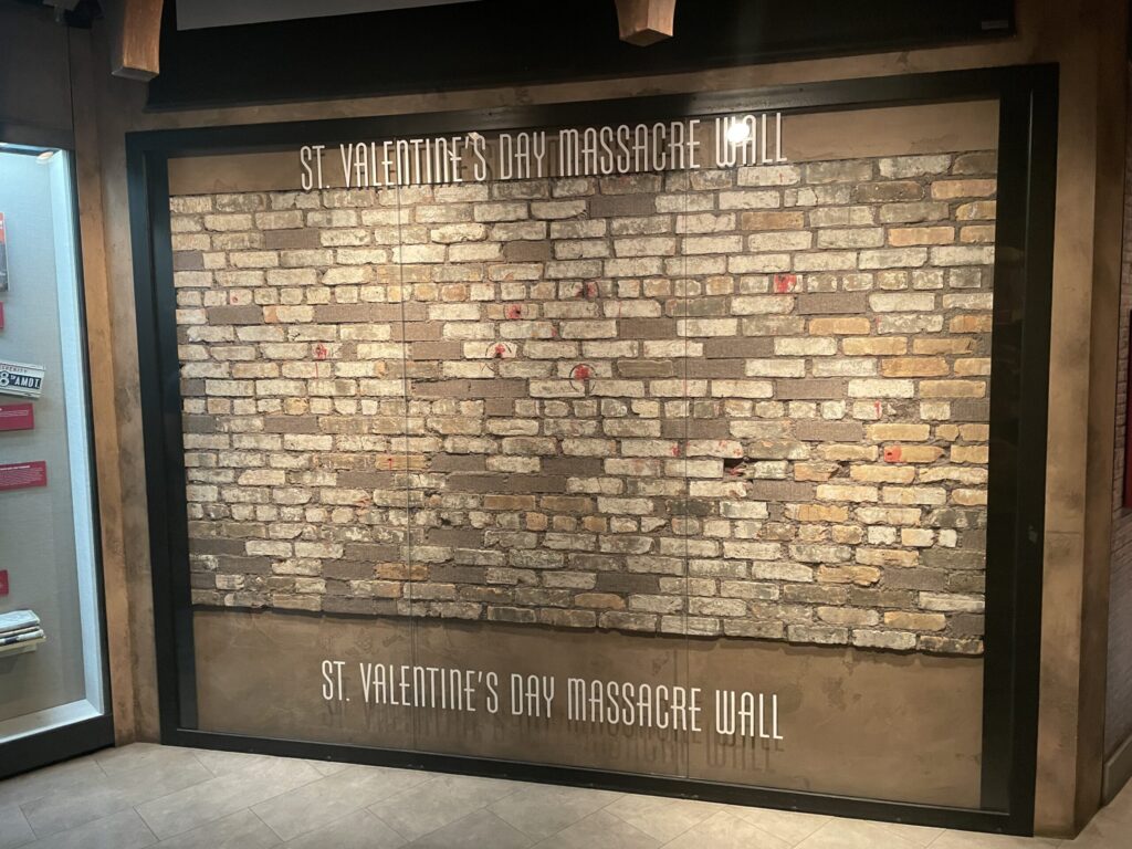Bricks from the St. Valentines Day Massacre Wall behind glass