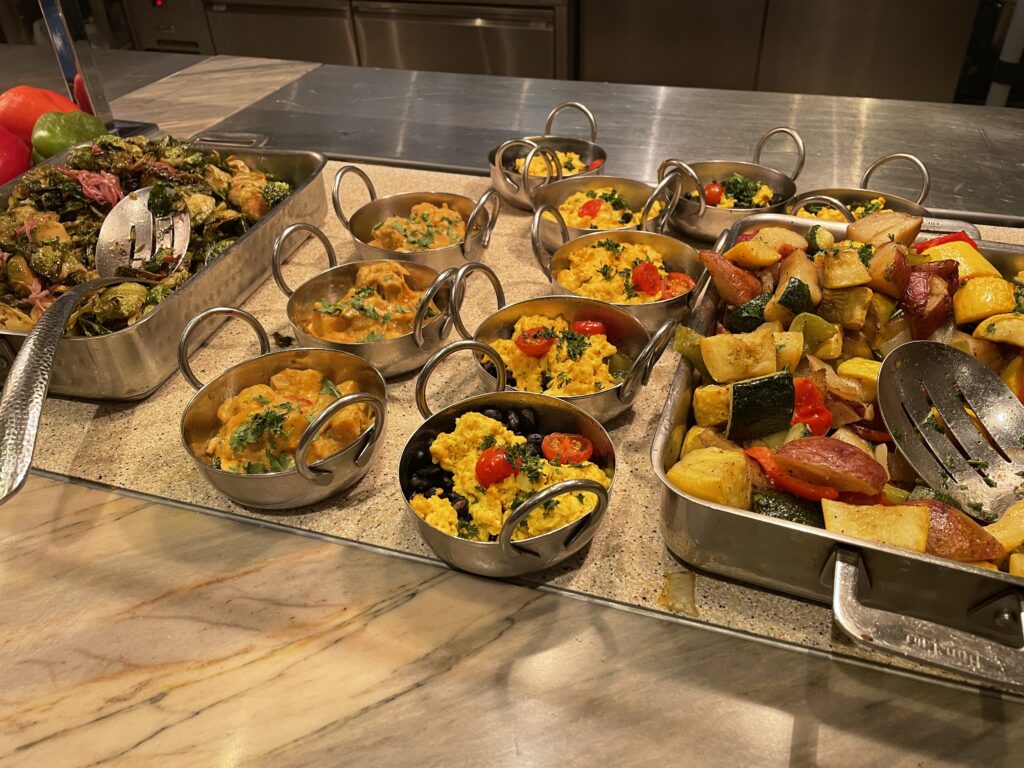 Individual servings of tofu scramblers, and vegie potato hash